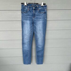 American Eagle Super Stretch Mid-Rise Frayed Bottom Jeggings